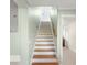 Interior staircase with light wood and white risers at 1324 N Peninsula Ave, New Smyrna Beach, FL 32169