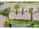 Aerial view of townhouses with private driveways and a lake at 137 Grey Widgeon Ct, Daytona Beach, FL 32119