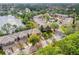 Aerial view of community with pool, lake, and townhouses at 137 Grey Widgeon Ct, Daytona Beach, FL 32119