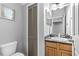 Small bathroom with granite vanity and updated toilet at 137 Grey Widgeon Ct, Daytona Beach, FL 32119