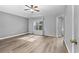 Bright bedroom featuring wood-look floors and a ceiling fan at 137 Grey Widgeon Ct, Daytona Beach, FL 32119