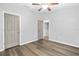 Second bedroom with wood-look floors and access to hallway at 137 Grey Widgeon Ct, Daytona Beach, FL 32119