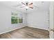 Bright bedroom with large window and ceiling fan at 137 Grey Widgeon Ct, Daytona Beach, FL 32119