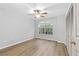 Bright bedroom with wood-look floors and ceiling fan at 137 Grey Widgeon Ct, Daytona Beach, FL 32119