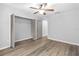 Bedroom with wood-look floors and large closet at 137 Grey Widgeon Ct, Daytona Beach, FL 32119