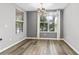 Bright dining room with hardwood floors and large window at 137 Grey Widgeon Ct, Daytona Beach, FL 32119