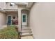 Front entrance with steps leading to a white door at 137 Grey Widgeon Ct, Daytona Beach, FL 32119