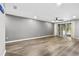 Living room with hardwood floors and sliding doors leading to the patio at 137 Grey Widgeon Ct, Daytona Beach, FL 32119