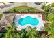 Community pool with a pool house and lounge chairs at 137 Grey Widgeon Ct, Daytona Beach, FL 32119