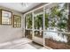 Screened porch with lake view and ceiling fan at 137 Grey Widgeon Ct, Daytona Beach, FL 32119