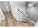 Modern staircase with light gray walls and wood flooring at 137 Grey Widgeon Ct, Daytona Beach, FL 32119