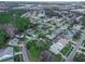 Aerial view of neighborhood with various houses and green spaces at 1381 S Wembley Cir, Port Orange, FL 32128