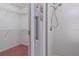 Bathroom with shower stall, closet, and pink carpet at 1381 S Wembley Cir, Port Orange, FL 32128