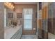 Small bathroom with shower/tub combo and window at 1381 S Wembley Cir, Port Orange, FL 32128