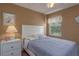 Bedroom with double bed, nightstand, and window at 1381 S Wembley Cir, Port Orange, FL 32128