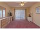 Bedroom with a ceiling fan and carpet flooring at 1381 S Wembley Cir, Port Orange, FL 32128