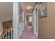 Upper level hallway with carpet and view of sitting area at 1381 S Wembley Cir, Port Orange, FL 32128