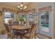 Kitchen nook with round table, four chairs and view of pool at 1381 S Wembley Cir, Port Orange, FL 32128