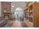 Living room with brick fireplace and hardwood floors at 1381 S Wembley Cir, Port Orange, FL 32128