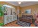 Sitting room with hardwood floors, leather couch, and white cabinet at 1381 S Wembley Cir, Port Orange, FL 32128