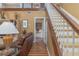 View of the home's staircase from the living room at 1381 S Wembley Cir, Port Orange, FL 32128