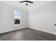 Well-lit bedroom with wood-look floors and window at 142 Sandpiper Ridge Dr, Ormond Beach, FL 32176