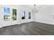 Formal dining room with gray wood-look floors and double doors at 142 Sandpiper Ridge Dr, Ormond Beach, FL 32176