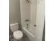 Clean bathroom features a white tiled shower and tub, and updated fixtures at 1500 Wildrose Ln, Daytona Beach, FL 32117