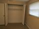 Bedroom closet with bi-fold doors and shelving at 1500 Wildrose Ln, Daytona Beach, FL 32117