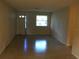 Living room with light walls and terrazzo flooring at 1500 Wildrose Ln, Daytona Beach, FL 32117