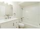 Updated bathroom with white vanity and bathtub at 18 Wildwood Dr, Edgewater, FL 32132