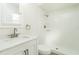 Clean bathroom with white vanity, shower, and toilet at 18 Wildwood Dr, Edgewater, FL 32132