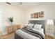 Guest bedroom with gray headboard and wooden nightstand at 18 Wildwood Dr, Edgewater, FL 32132