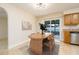 Bright dining area with wood table and chairs, adjacent to kitchen at 18 Wildwood Dr, Edgewater, FL 32132