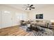 Light and airy living room with hardwood floors and modern furniture at 18 Wildwood Dr, Edgewater, FL 32132