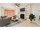 Bright living room with fireplace and built-in shelving at 18 Wildwood Dr, Edgewater, FL 32132