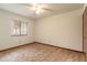 A simple bedroom featuring carpet, a ceiling fan, and a window at 1820 Sabal Palm Dr, Edgewater, FL 32132