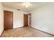 Bedroom with carpeted floors and two doors leading to other rooms at 1820 Sabal Palm Dr, Edgewater, FL 32132