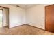 A modest-sized bedroom with carpeted floors and wood-trimmed doors at 1820 Sabal Palm Dr, Edgewater, FL 32132