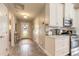 Bright and airy entryway with tile flooring and access to kitchen at 1846 Turnbull Lakes Dr, New Smyrna Beach, FL 32168