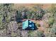 Overhead view of log cabin in a wooded setting at 187 N Samsula Dr, New Smyrna Beach, FL 32168