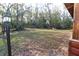 Simple backyard with open space and a wooden structure at 187 N Samsula Dr, New Smyrna Beach, FL 32168