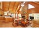 Open concept kitchen and dining area with vaulted wood ceilings at 187 N Samsula Dr, New Smyrna Beach, FL 32168