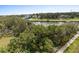 Aerial view showcasing lush landscaping and waterfront access at 2 Riverwalk Dr # 502, New Smyrna Beach, FL 32169