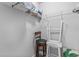 Storage closet with shelving and a stool at 2 Riverwalk Dr # 502, New Smyrna Beach, FL 32169