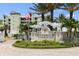 Riverwalk Condominiums entrance with lush landscaping and signage at 2 Riverwalk Dr # 502, New Smyrna Beach, FL 32169