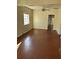 Bright living room with ceiling fan and brown flooring at 202 S Myrtle Ave, New Smyrna Beach, FL 32168