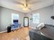 Bright bedroom with wood floors and built-in workspace at 2202 Venetian Ave, Belle Isle, FL 32809