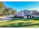 Gray house with a white picket fence and a large lawn at 2202 Venetian Ave, Belle Isle, FL 32809