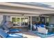 Relaxing patio with covered seating, grill, and access to the pool at 2202 Venetian Ave, Belle Isle, FL 32809